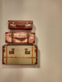 Close-up of old stack against wall