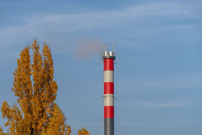 Low angle view of red tower against sky