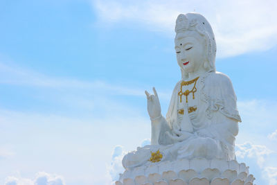 Low angle view of statue against sky