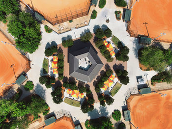 High angle view of buildings and trees in city