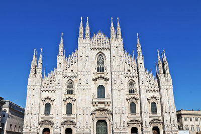 Low angle view of building against blue sky