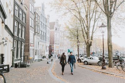 People walking on street in city