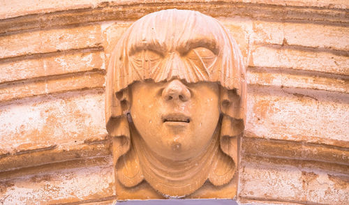 Close-up of statue against wall