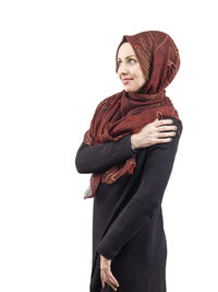 Portrait of a smiling young woman over white background
