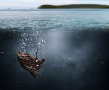 Boat sinking in sea
