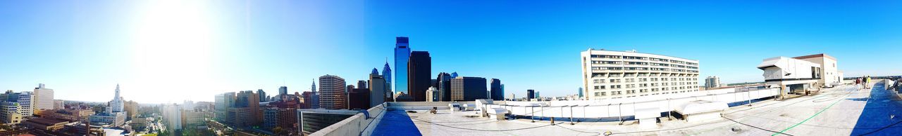 Buildings against clear blue sky