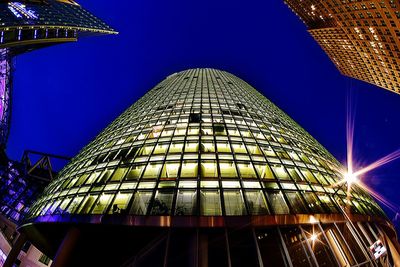 Low angle view of illuminated building at night