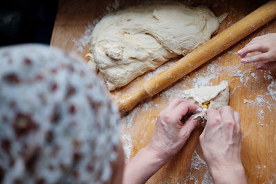 Midsection of person preparing food