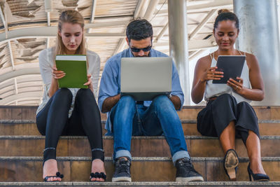 Friends sitting on mobile phone