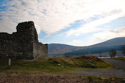 View of temple against cloudy sky