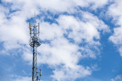 Low angle view of communication tower against sky