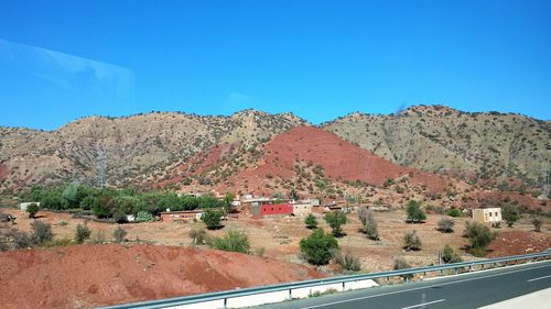 Scenic view of mountains against clear blue sky