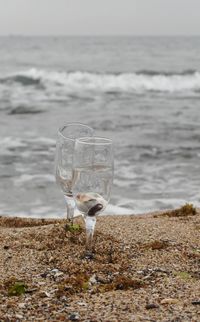 View of drinking glass on beach