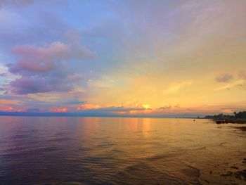 Scenic view of sea against sky at sunset