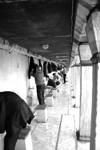 High angle view of people standing on tiled floor