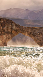 Stunning stone arch in the middle of the lake, posadas lake, argentina
