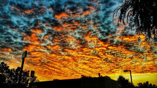 Low angle view of cloudy sky at sunset