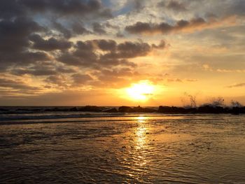 Scenic view of sea at sunset