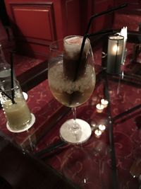 Close-up of wine glasses on table