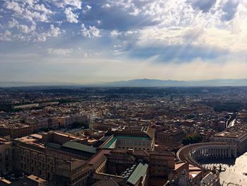 High angle view of city against cloudy sky