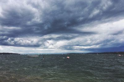 Scenic view of sea against cloudy sky