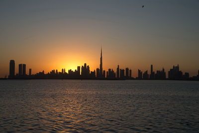 Dubai slyline from dubai creek harbour and dubai canal to downtown and business bay, uae