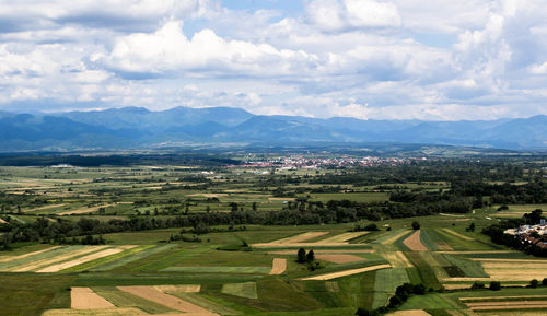 Aerial view of agricultural field against sky