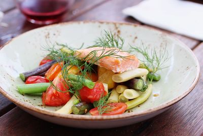 Close-up of fresh vegetables in plate on table