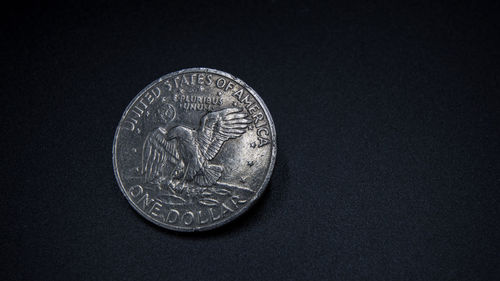 Close-up of coin on table