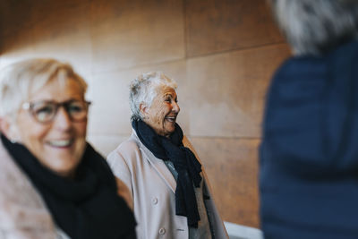 Happy senior woman looking away