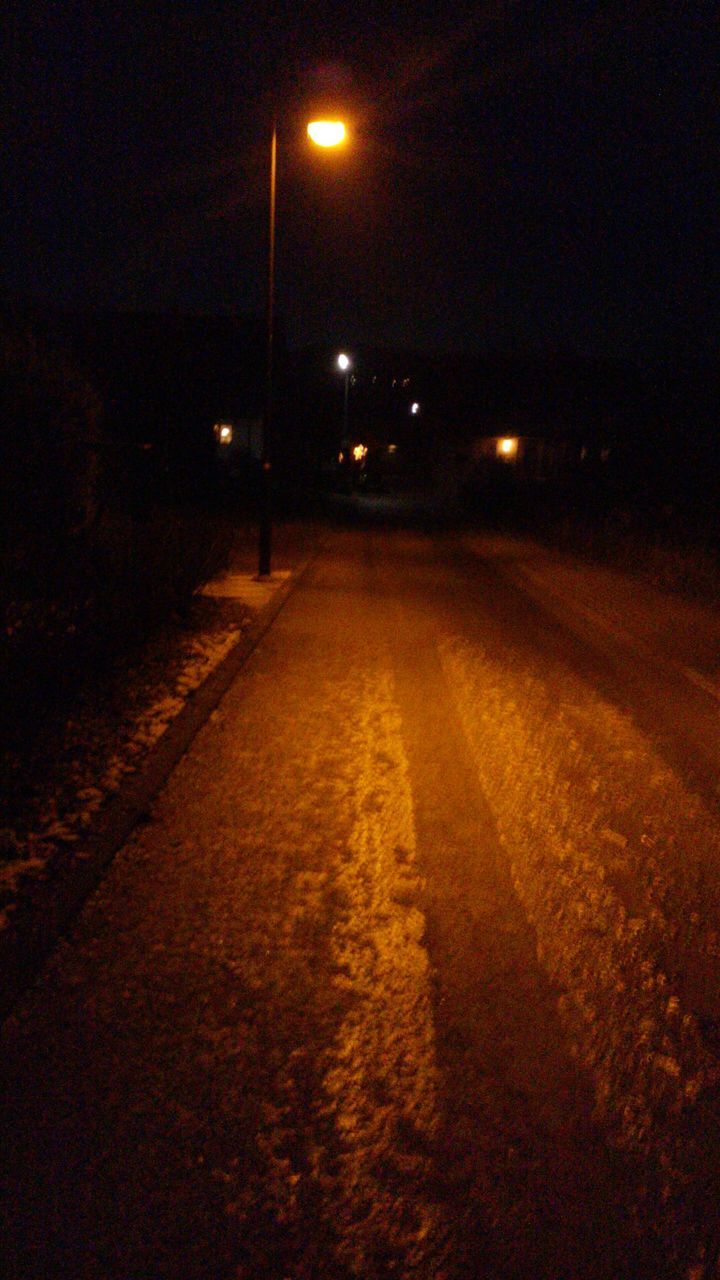 night, illuminated, the way forward, street light, road, lighting equipment, transportation, street, diminishing perspective, dark, vanishing point, light - natural phenomenon, empty, road marking, empty road, no people, outdoors, surface level, long, asphalt