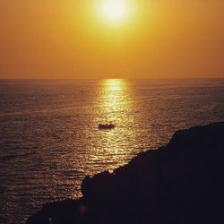 Scenic view of sea at sunset