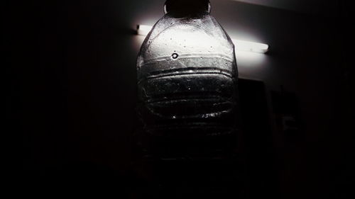 Close-up of beer bottle against black background