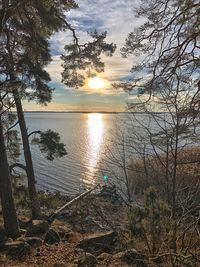 Scenic view of lake against sky during sunset