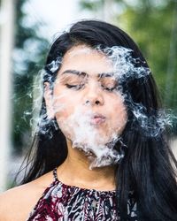 Close-up of young woman in water