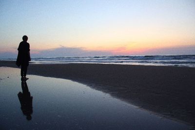 Scenic view of sea at sunset