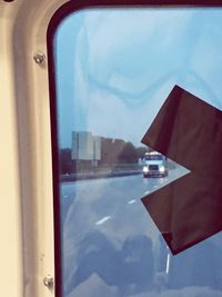 View of buildings against cloudy sky