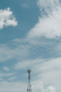 Low angle view of communications tower against sky