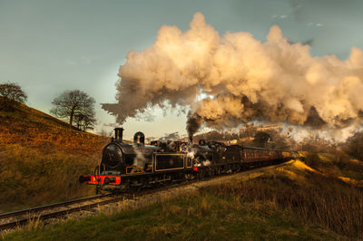 Steam engine train on landscape