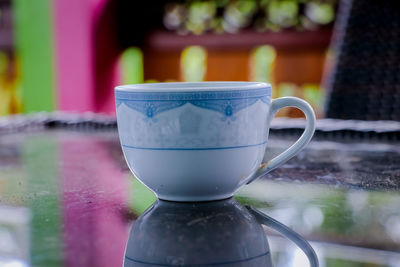 Close-up of coffee cup on table