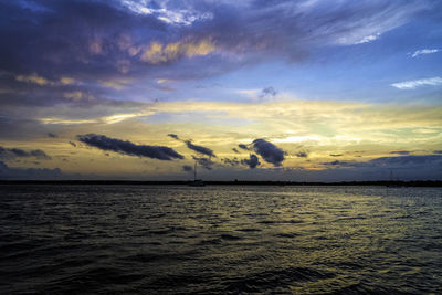 Scenic view of sea against dramatic sky