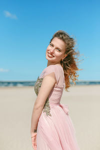 Portrait of a smiling young woman on beach