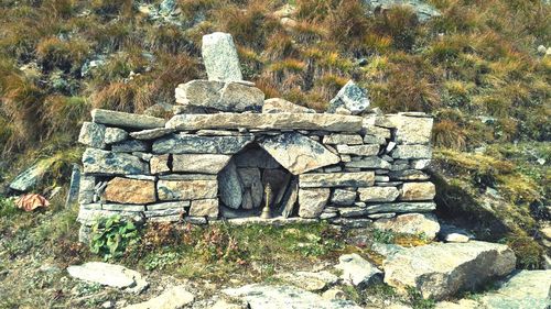 Stone structure against trees