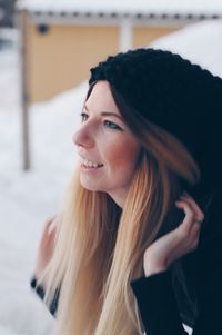 Close-up of young woman looking away