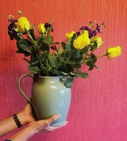 Close-up of yellow flowers in vase