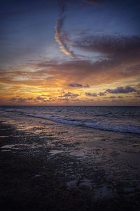 Scenic view of sea against sky at sunset