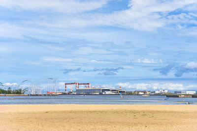 View of beach against cloudy sky