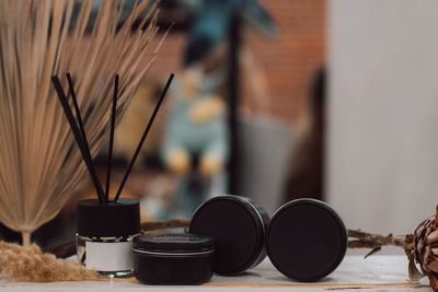 Mockup of aroma sticks and black candles on a blurred background. relaxation and home accessories