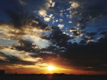 Scenic view of dramatic sky during sunset