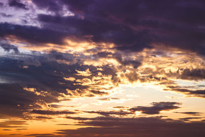 Low angle view of clouds in sky during sunset